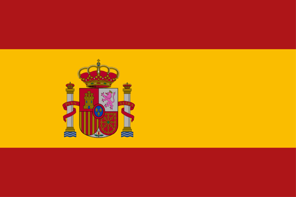 The flag of spain, featuring three horizontal bands of red, yellow, and red, with the national coat of arms on the yellow band toward the hoist side.