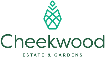The image displays the logo of "cheekwood estate & gardens," featuring a stylized representation of a pineapple, which is a symbol of hospitality, above a geometrically patterned square that may represent a garden layout, all rendered in a soothing green hue that suggests nature and growth.