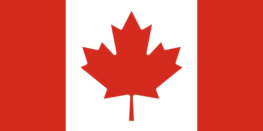 A canadian flag with a prominent red maple leaf centered between two vertical bands of red and a larger white band.