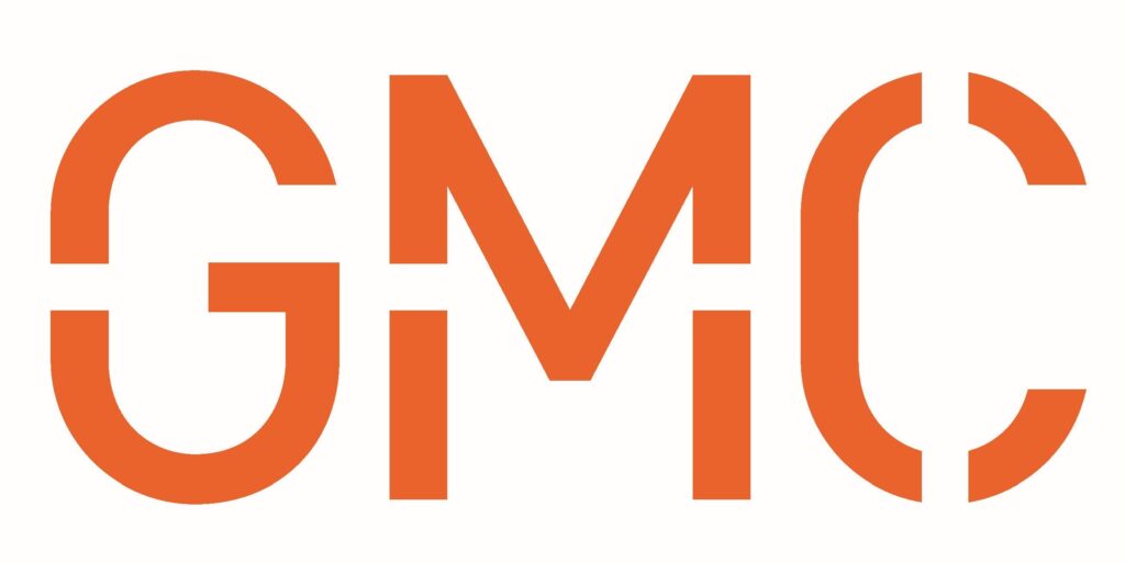 The image shows the logo of gmc, which is an american automotive company known for manufacturing trucks, suvs, and commercial vehicles. the logo consists of the capitalized letters "gmc" in a bold orange font with a white background.