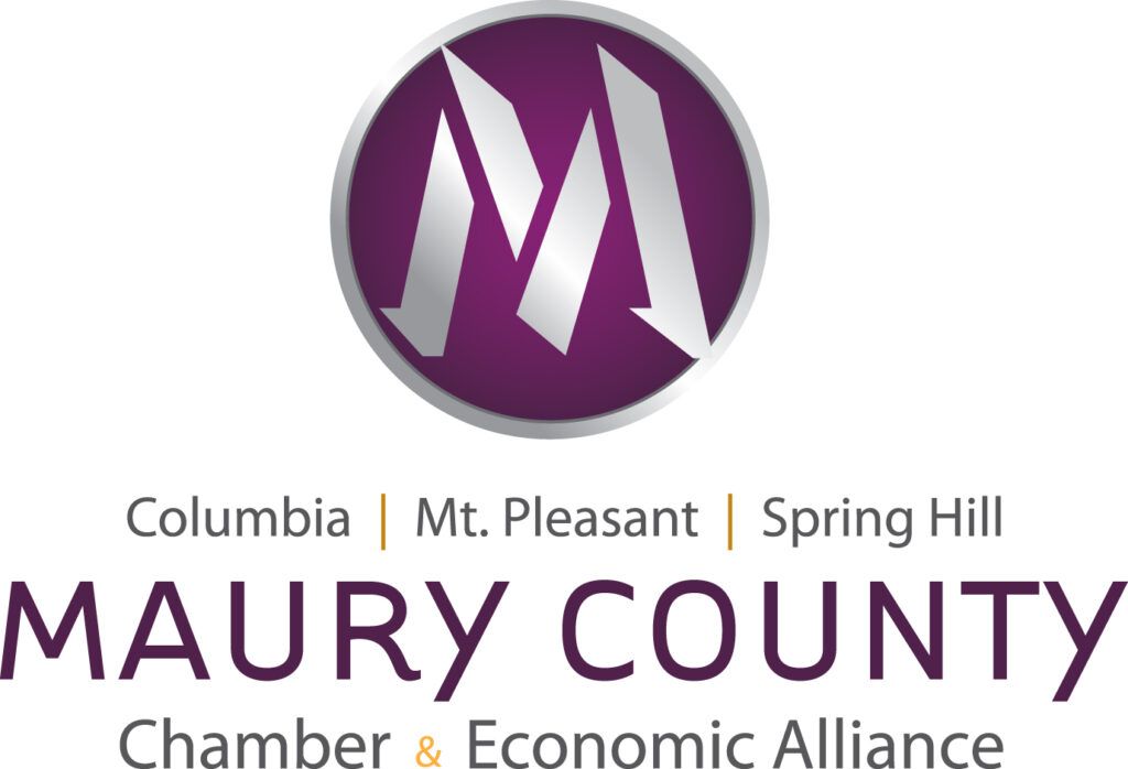 Logo of the maury county chamber & economic alliance featuring stylized 'm' letters in a circle with the names of columbia, mt. pleasant, and spring hill.