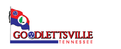 The image is a logo that includes the name "goodlettsville tennessee" in capitalized red lettering, with a graphic representation of the state of tennessee in white, featuring three stars inside a blue circle which is a nod to the tennessee state flag. the background is dark, and the graphic is encased in a partial outline resembling the state's border, highlighted in red and blue.