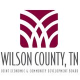 The image displays the logo of the wilson county, tennessee joint economic & community development board, featuring a stylized w in a rich maroon color with the full name of the organization emblazoned below it.