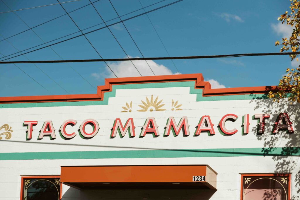 Sunny skies over taco mamacita: a vibrant eatery under blue skies.